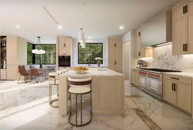 a kitchen with stainless steel appliances kitchen island granite countertop a sink and cabinets