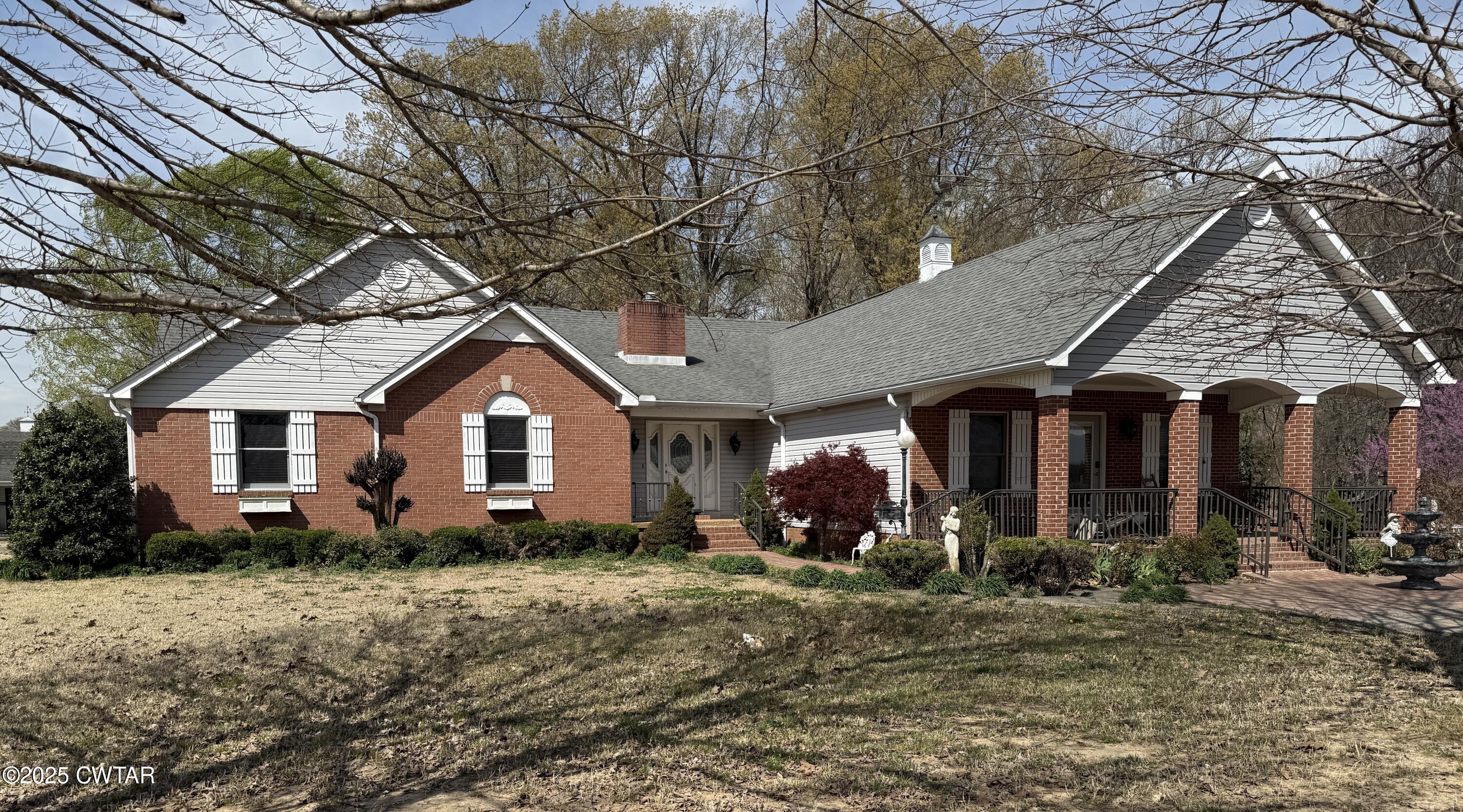 1268 Lightfoot Luckett Road Ripley, TN 38063 - Photo 1 of 40 a front view of house with yard and trees around