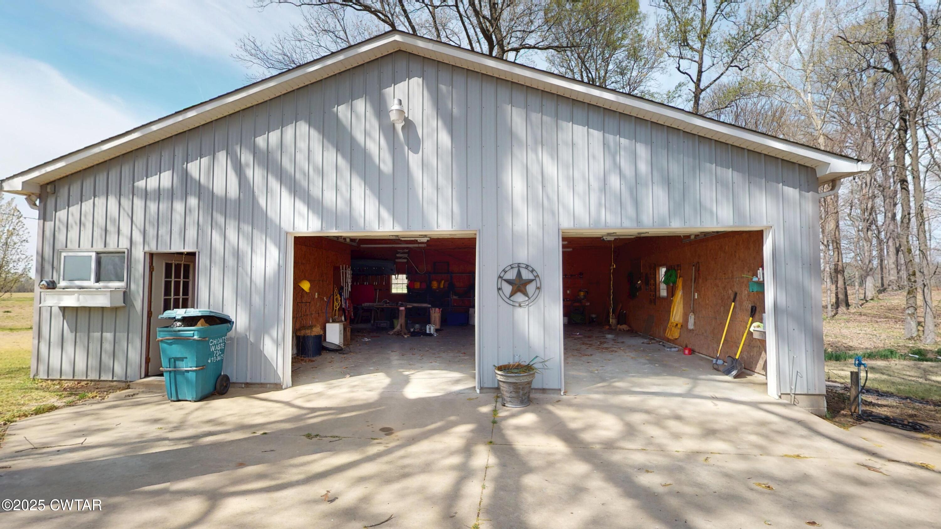 1268 Lightfoot Luckett Road Ripley, TN 38063 - Photo 33 of 40 a view of a house with a patio and fire pit