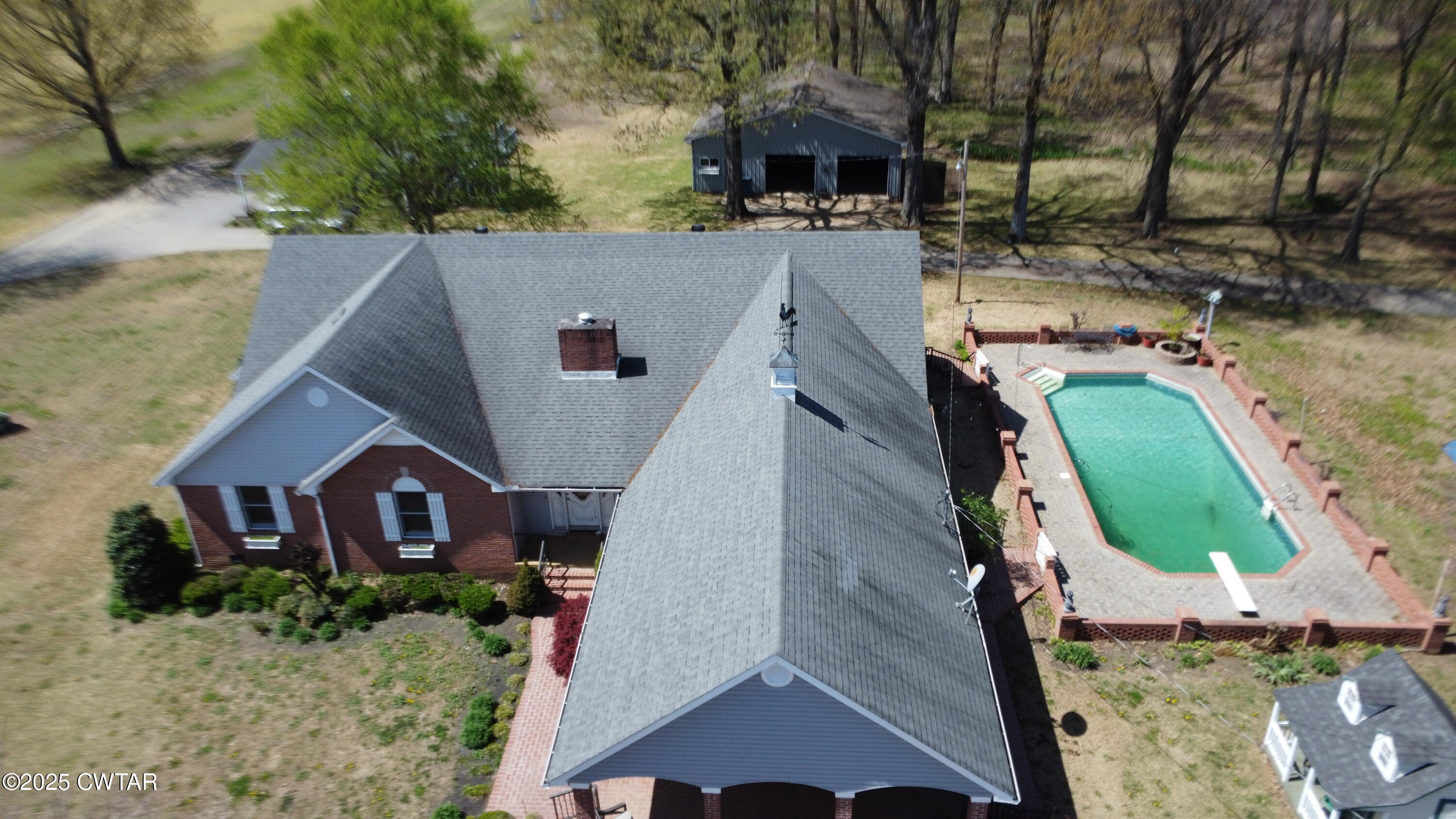1268 Lightfoot Luckett Road Ripley, TN 38063 - Photo 4 of 40 an aerial view of a house with a yard and large trees
