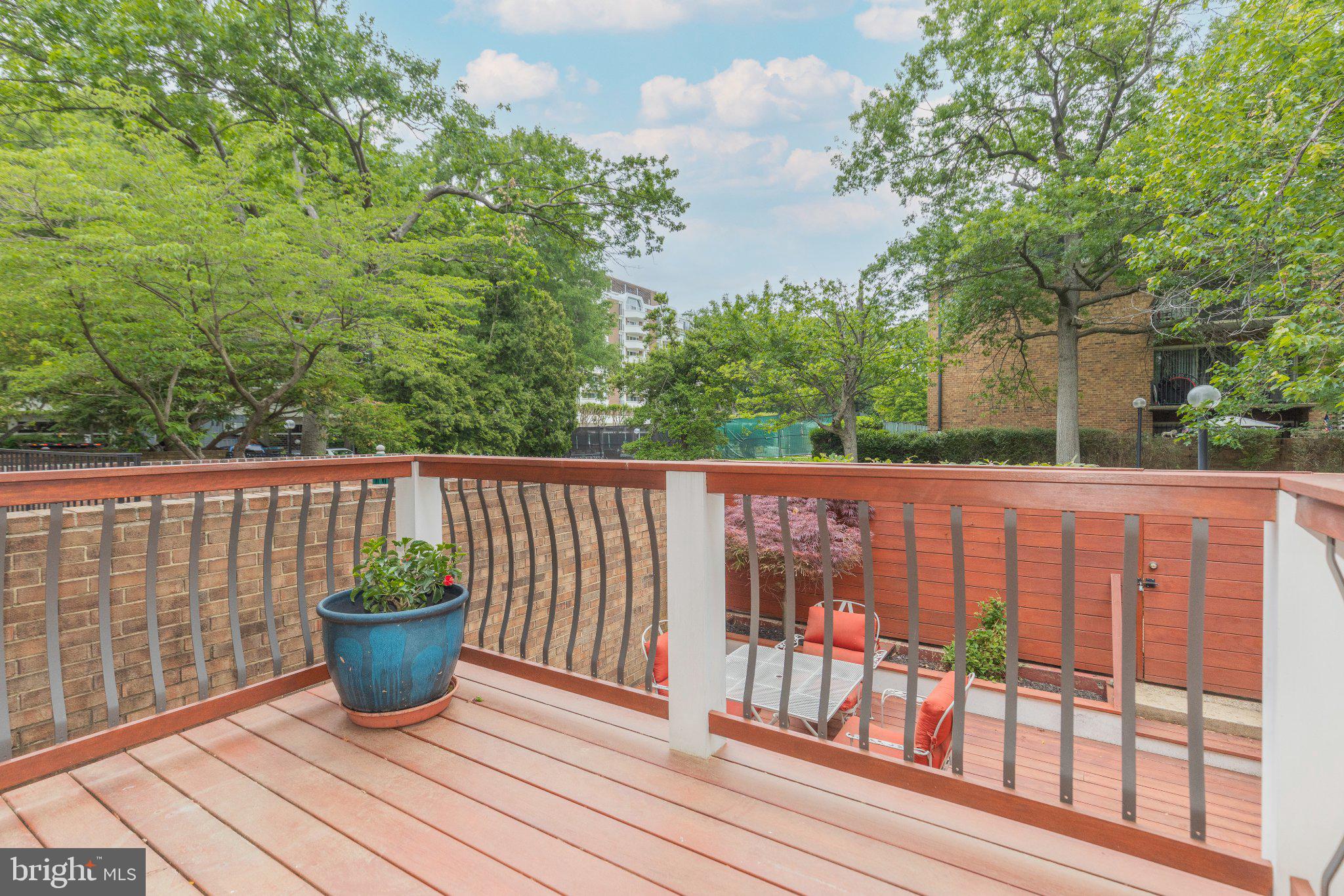 623 I Street Southwest Washington, DC 20024 - Photo 23 of 41 Serene balcony with lush greenery views.