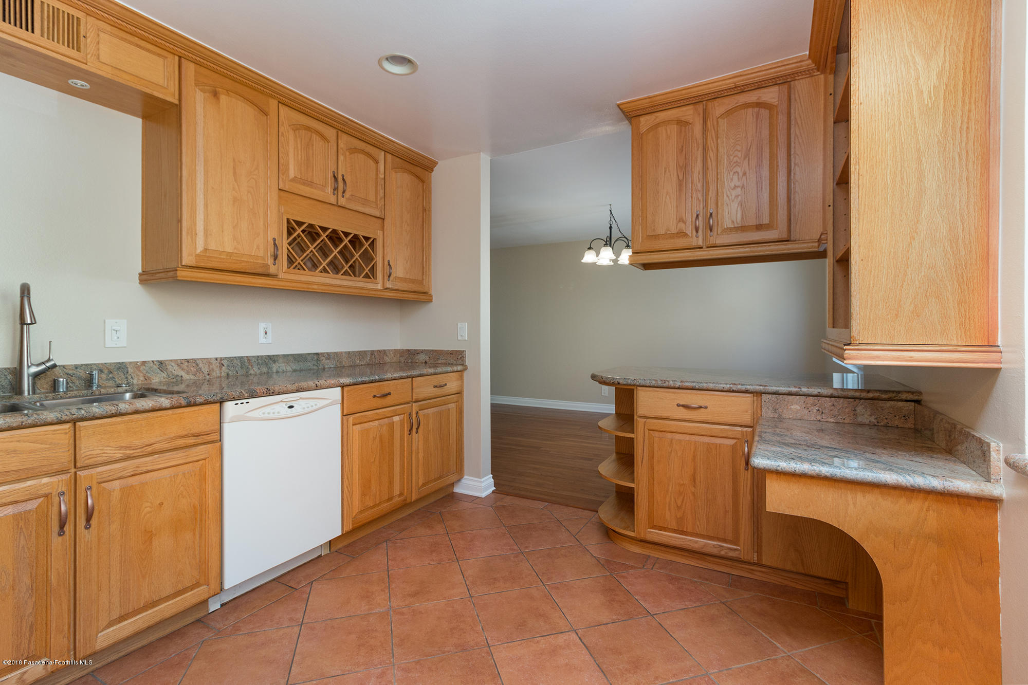 9730 Vía Roma Burbank, CA 91504 - Photo 13 of 24 a kitchen with stainless steel appliances granite countertop a sink and cabinets