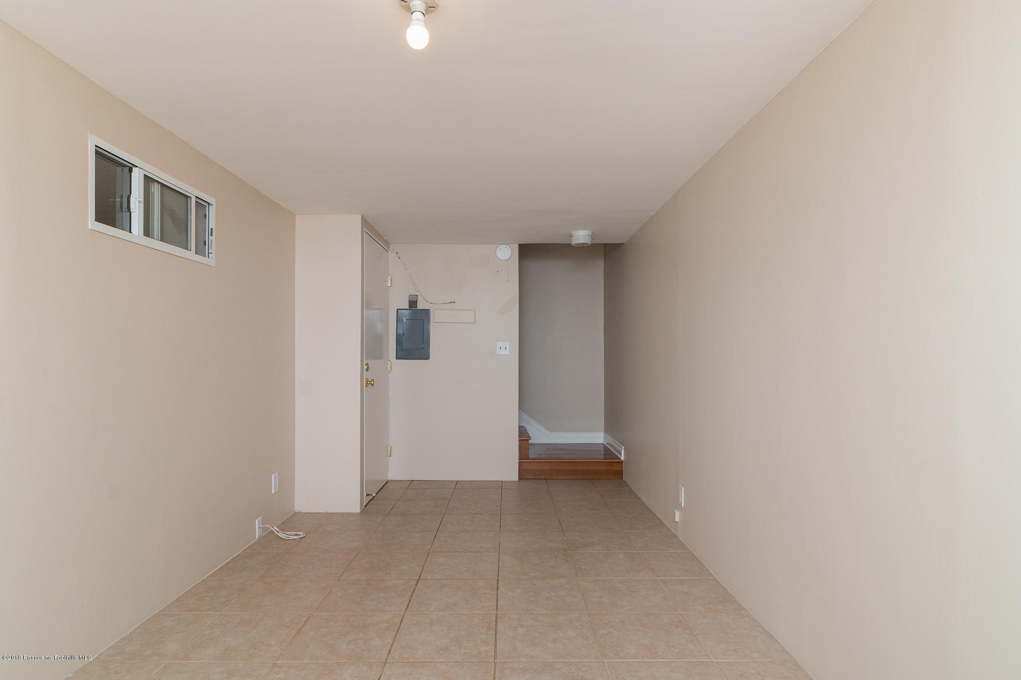 9730 Vía Roma Burbank, CA 91504 - Photo 15 of 24 an empty room with a natural light