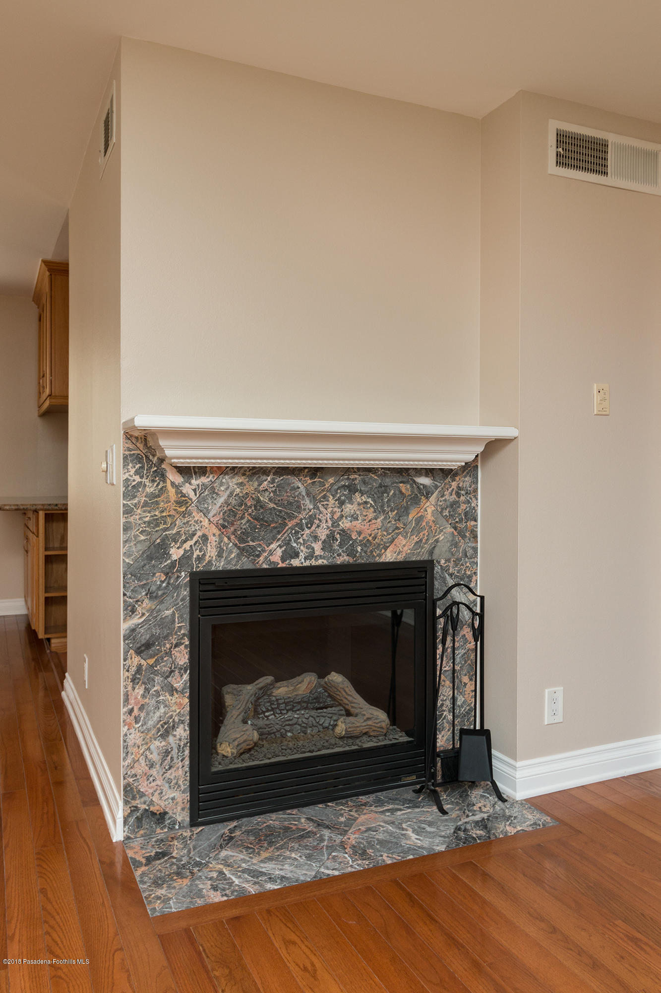 9730 Vía Roma Burbank, CA 91504 - Photo 5 of 24 a living room with a fireplace