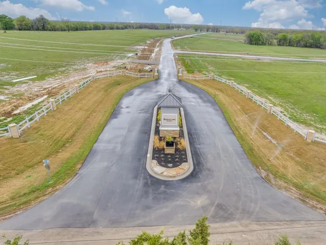 a view of a swimming pool with a yard