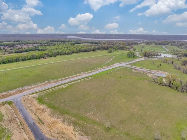 a view of a lake and a yard