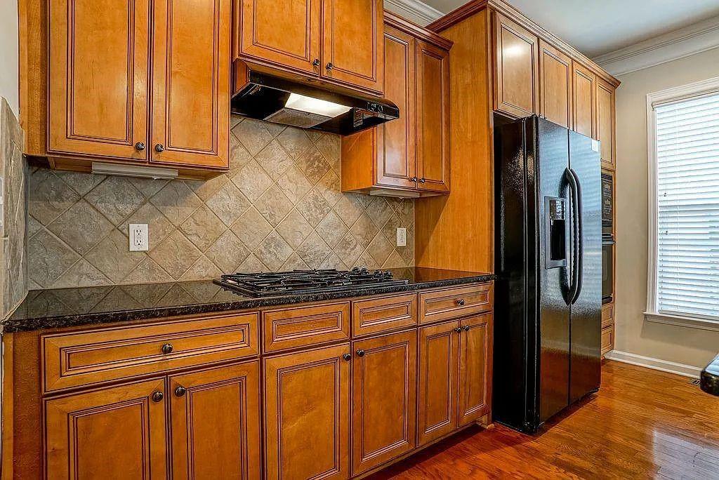 6120 Joybrook Road Duluth, GA 30097 - Photo 17 of 30 a kitchen with stainless steel appliances granite countertop a refrigerator and a stove