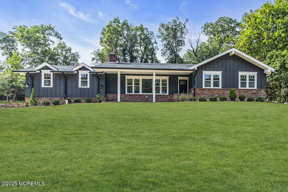 8 Holling Road Colts Neck, NJ 07722 - Photo 1 of 41 a front view of house with yard and green space