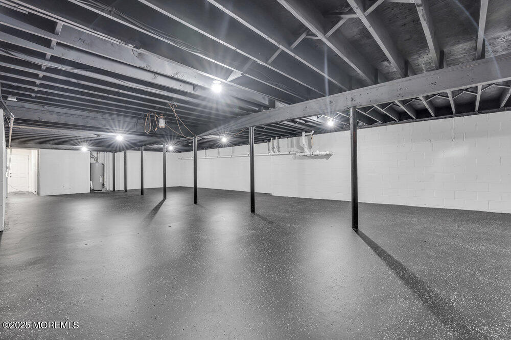 8 Holling Road Colts Neck, NJ 07722 - Photo 15 of 41 a view of a projector room with wooden floor