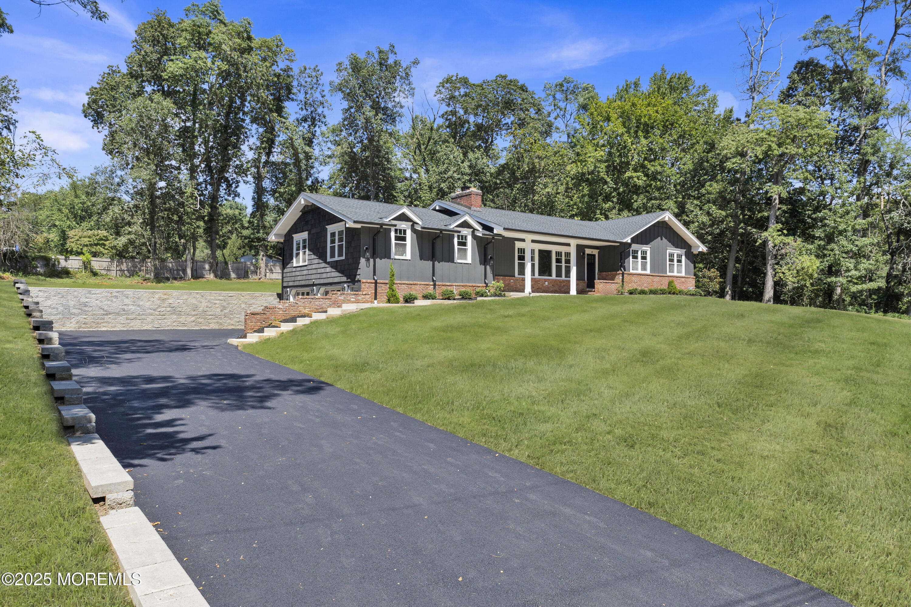 8 Holling Road Colts Neck, NJ 07722 - Photo 16 of 41 a front view of a house with a yard