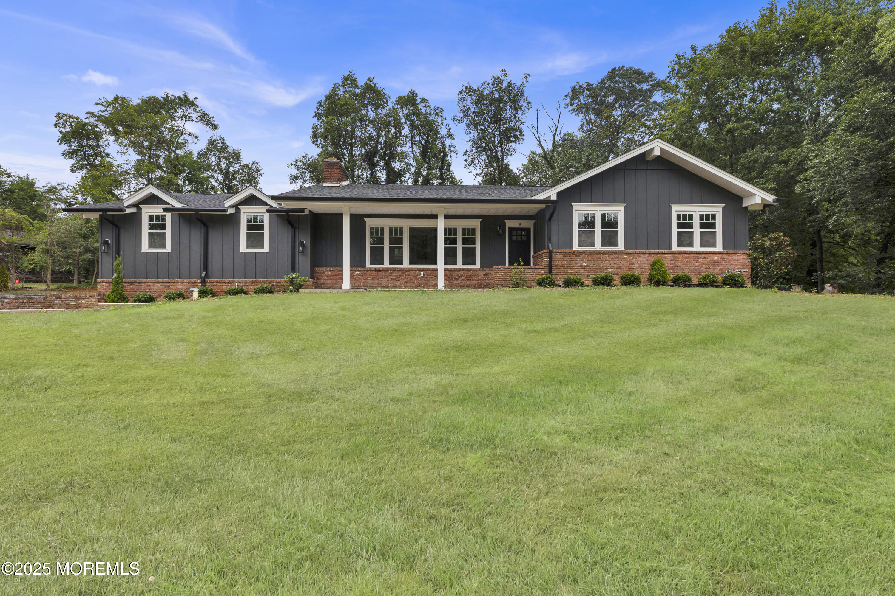 8 Holling Road Colts Neck, NJ 07722 - Photo 17 of 41 a front view of a house with a garden
