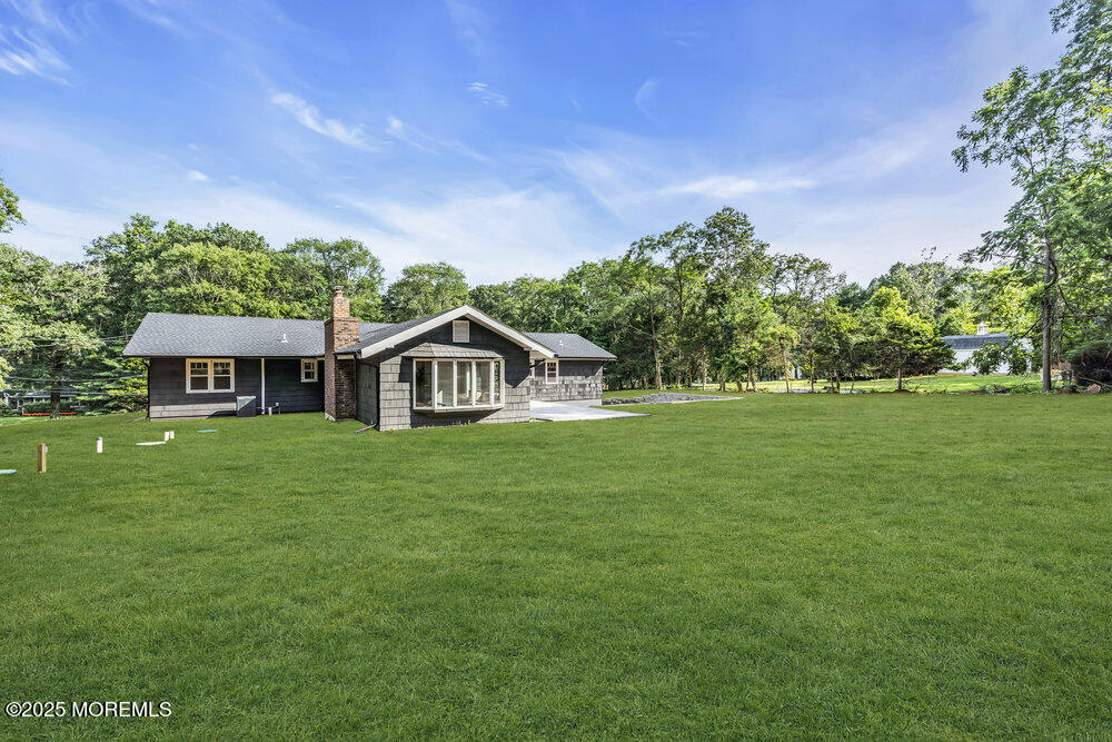 8 Holling Road Colts Neck, NJ 07722 - Photo 18 of 41 a front view of a house with garden