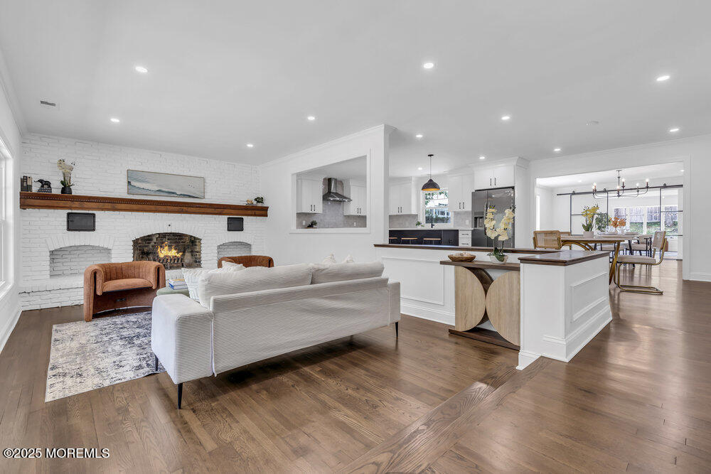 8 Holling Road Colts Neck, NJ 07722 - Photo 2 of 41 a living room with furniture and kitchen view