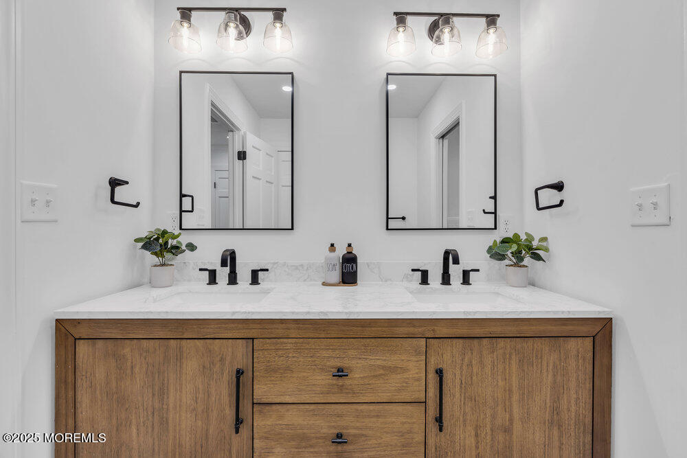 8 Holling Road Colts Neck, NJ 07722 - Photo 27 of 41 a bathroom with double sink and a mirror