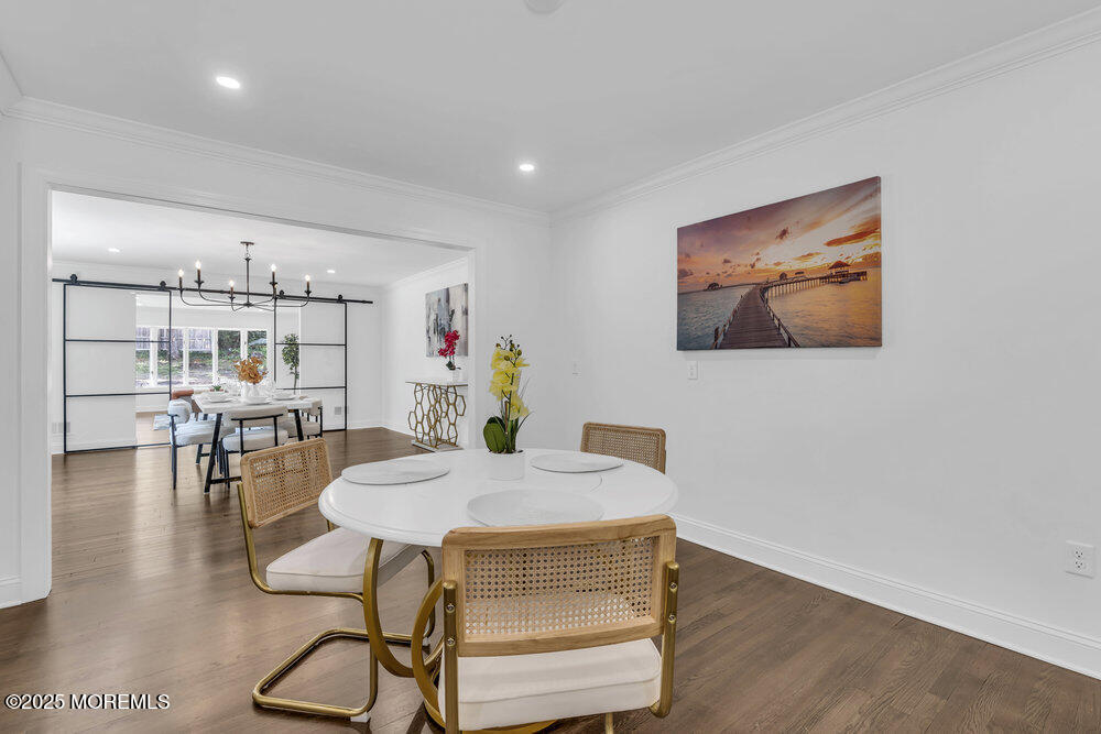 8 Holling Road Colts Neck, NJ 07722 - Photo 31 of 41 a view of a dining room with furniture and wooden floor