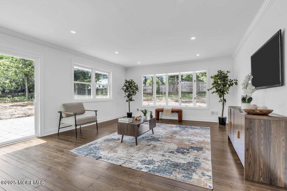 8 Holling Road Colts Neck, NJ 07722 - Photo 32 of 41 a living room with furniture and a flat screen tv