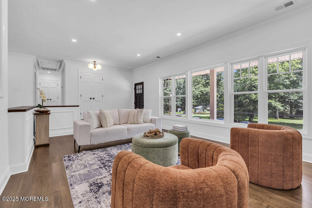 8 Holling Road Colts Neck, NJ 07722 - Photo 34 of 41 a living room with furniture and a large window