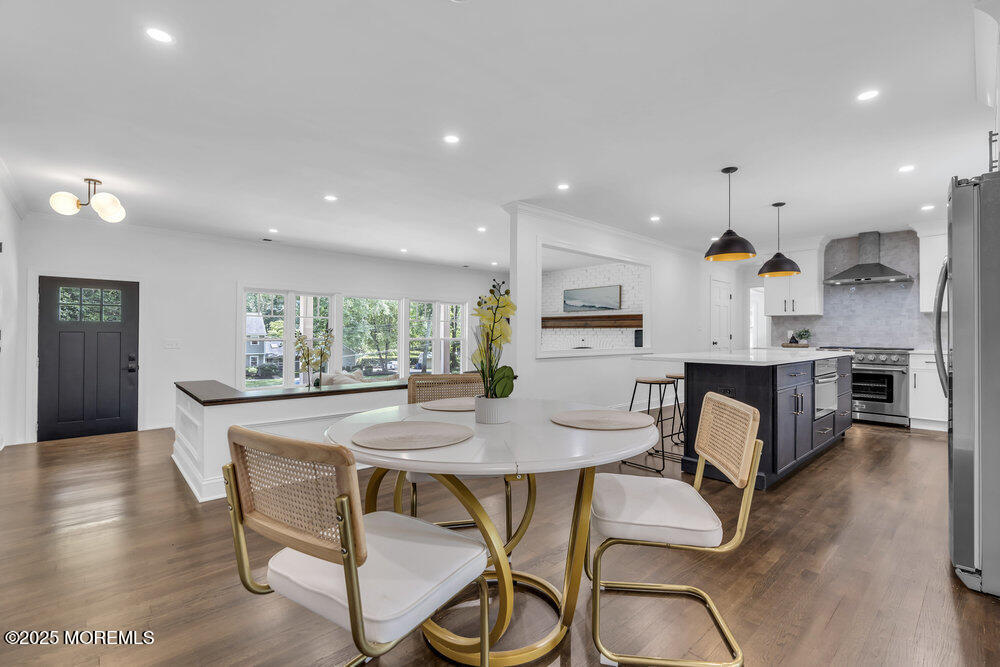 8 Holling Road Colts Neck, NJ 07722 - Photo 5 of 41 a view of a dining room with furniture and wooden floor