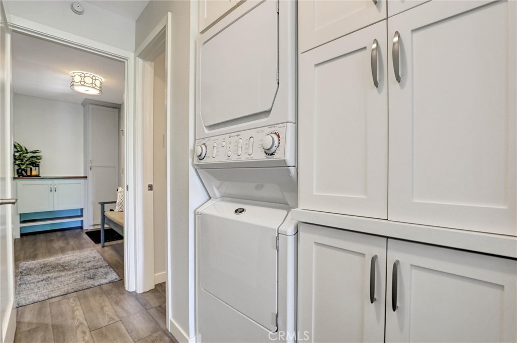 7890 East Spring Street, Unit 23H Long Beach, CA 90815 - Photo 29 of 39 Hallway with built-in storage laundry