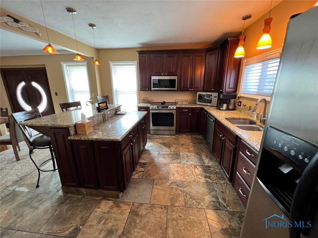 3525 Albon Road Maumee, OH 43537 - Photo 4 of 48 Kitchen island with bar seating.