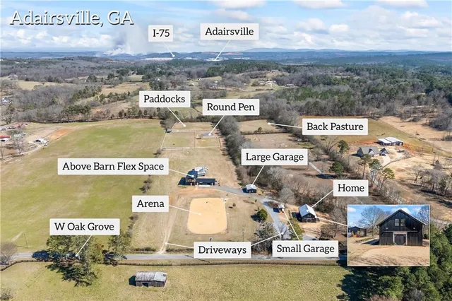 a view of a house with a yard covered with snow