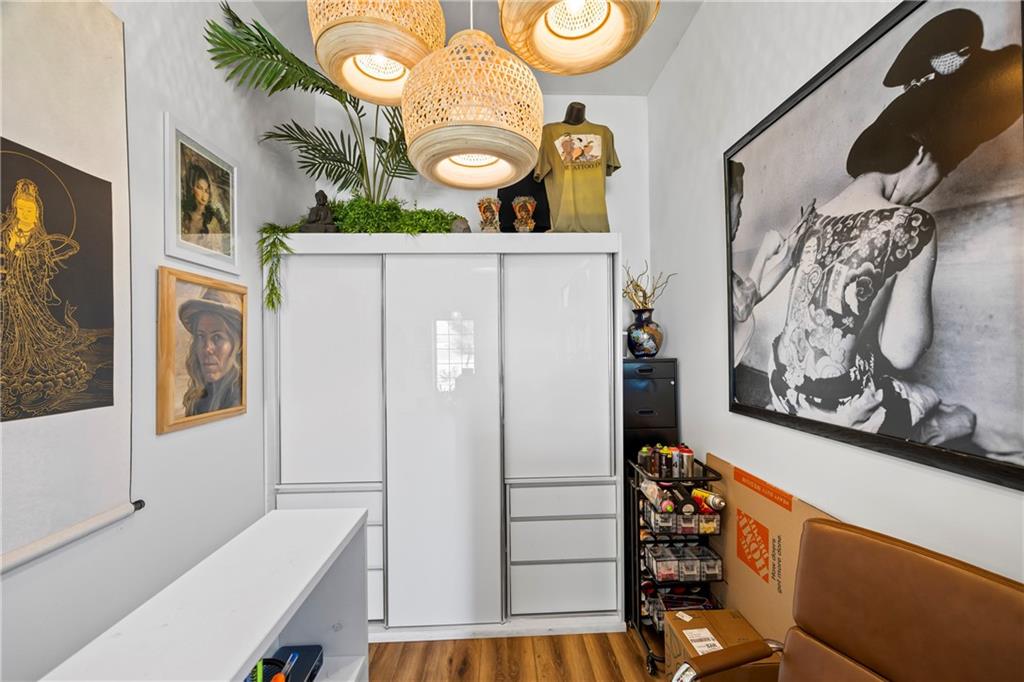356 West Oak Grove Road Northwest Adairsville, GA 30103 - Photo 11 of 128 a view of walk in closet with clothes and shoes