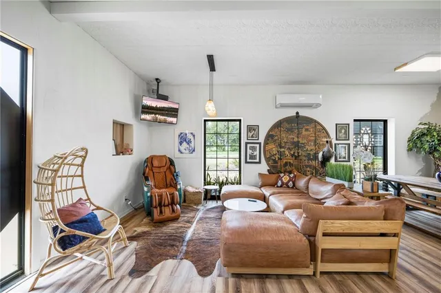 a bedroom with furniture and a ceiling fan