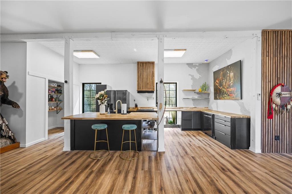 356 West Oak Grove Road Northwest Adairsville, GA 30103 - Photo 18 of 128 a view of a kitchen with cabinets stainless steel appliances and wooden floor