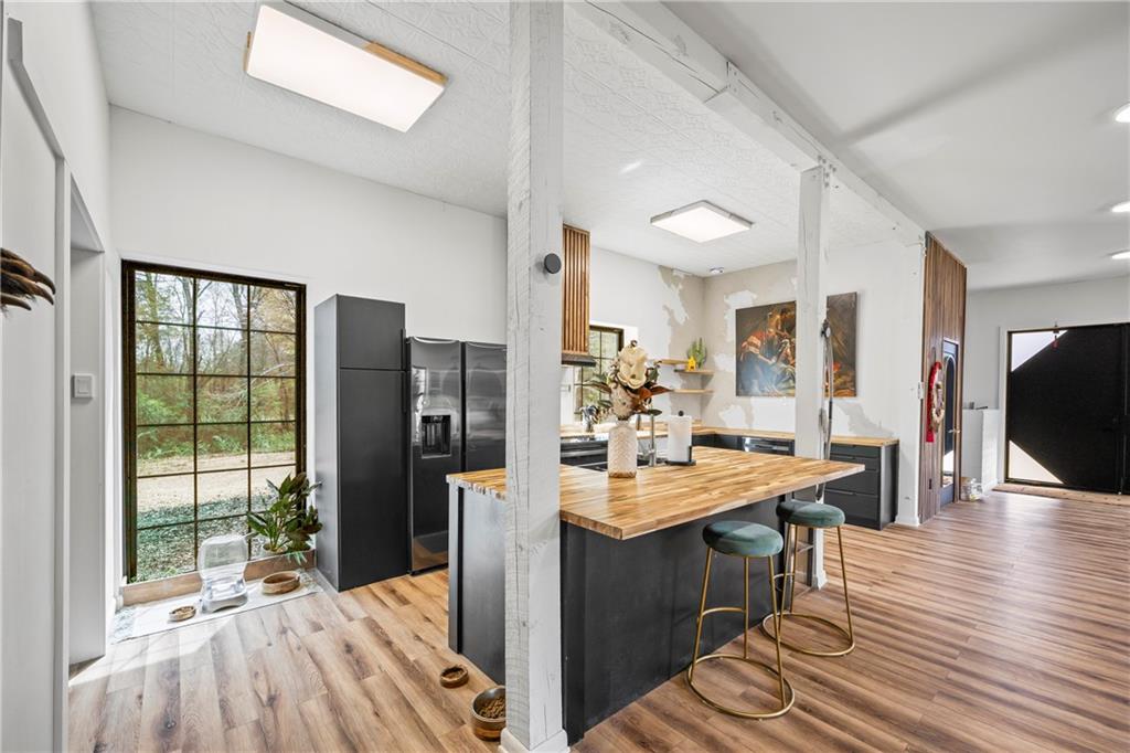 356 West Oak Grove Road Northwest Adairsville, GA 30103 - Photo 20 of 128 a view of a kitchen with kitchen island granite countertop a refrigerator stove top oven and sink