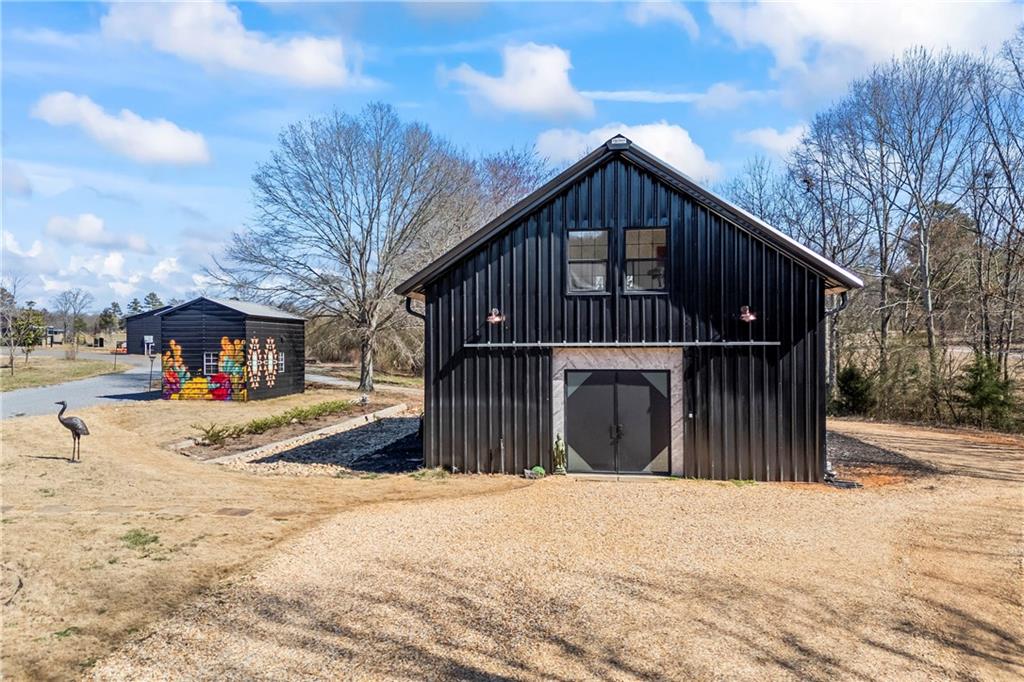 356 West Oak Grove Road Northwest Adairsville, GA 30103 - Photo 2 of 128 a view of a house with a yard covered with snow