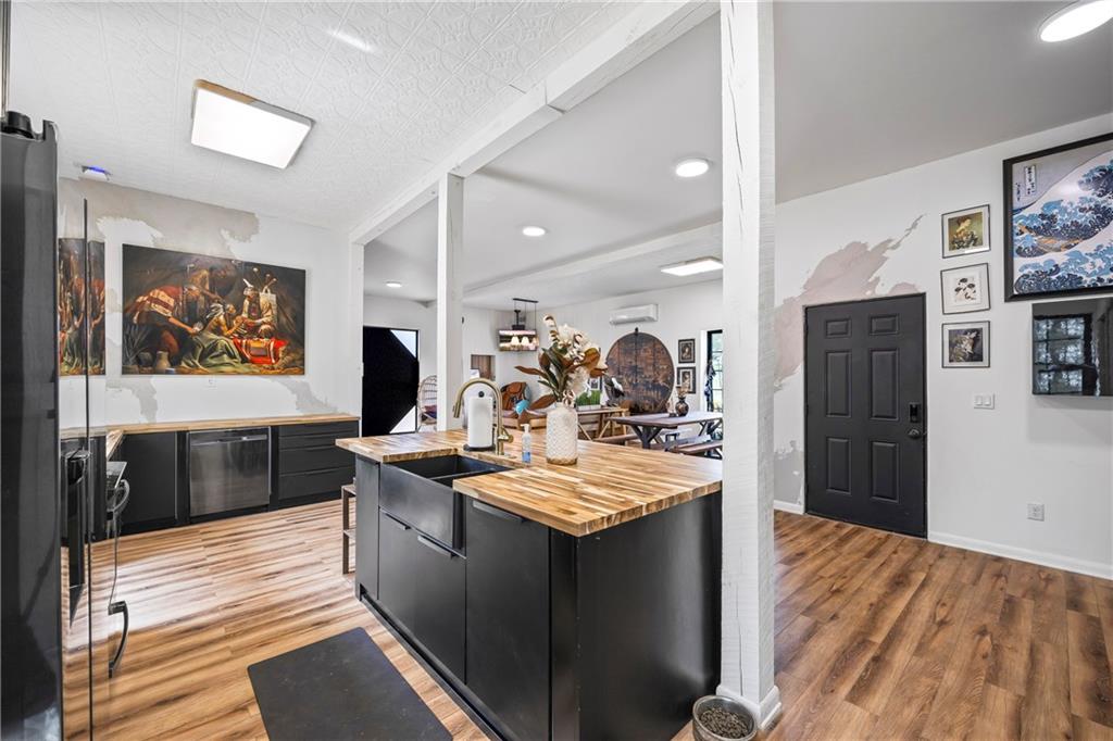 356 West Oak Grove Road Northwest Adairsville, GA 30103 - Photo 23 of 128 a kitchen with stainless steel appliances granite countertop a sink stove and wooden cabinets