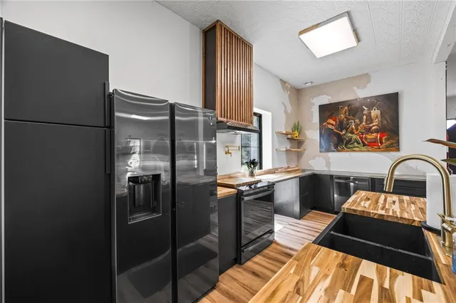 a view of a house with a yard and garage