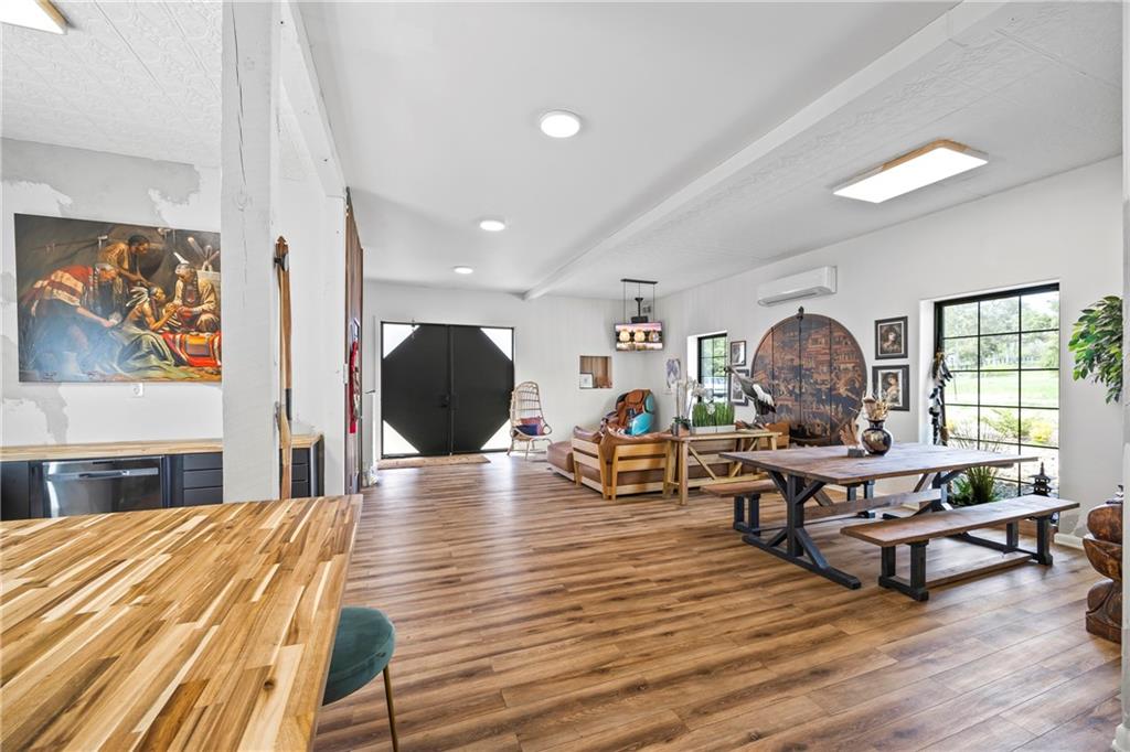 356 West Oak Grove Road Northwest Adairsville, GA 30103 - Photo 29 of 128 a living room with furniture and a wooden floor