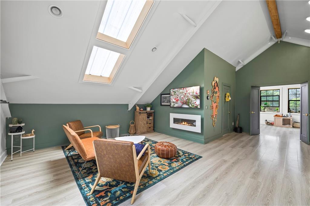 356 West Oak Grove Road Northwest Adairsville, GA 30103 - Photo 33 of 128 a living room with furniture a flat screen tv and a fireplace