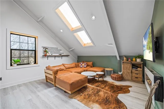 a bathroom with a granite countertop toilet a sink and a mirror