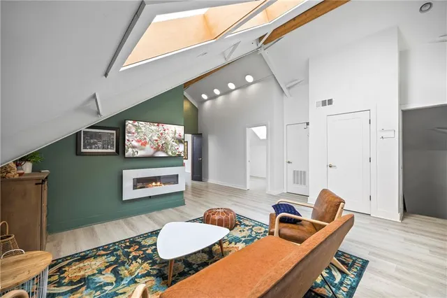 a view of an empty room with a staircase