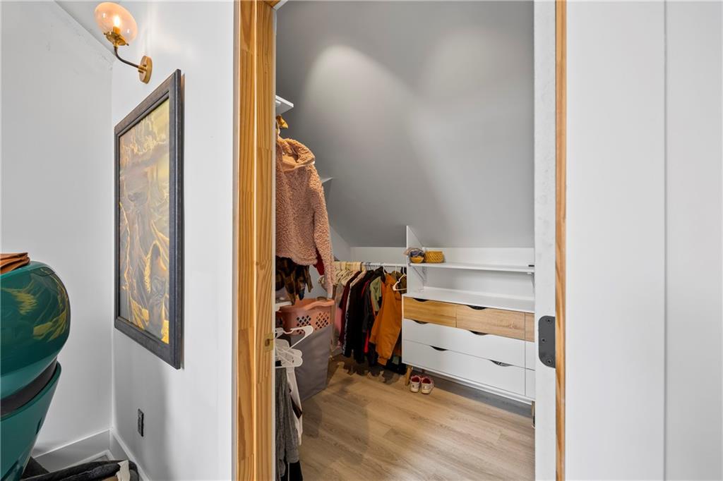 356 West Oak Grove Road Northwest Adairsville, GA 30103 - Photo 41 of 128 a view of walk in closet with clothes and shoes