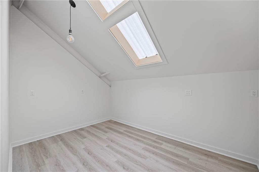 356 West Oak Grove Road Northwest Adairsville, GA 30103 - Photo 46 of 128 a view of empty room with wooden floor and fan