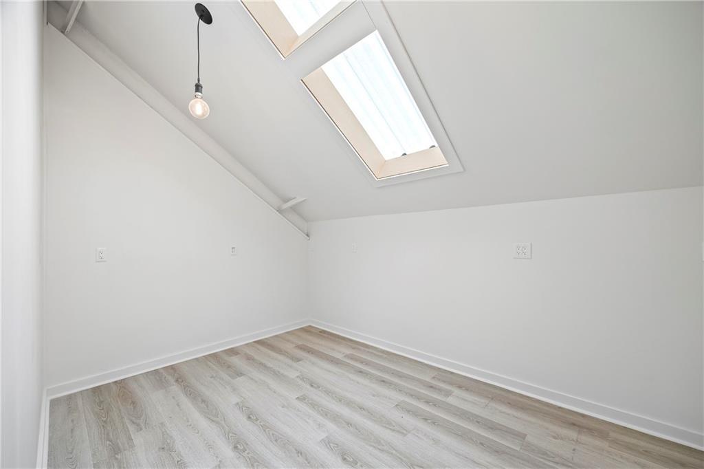 356 West Oak Grove Road Northwest Adairsville, GA 30103 - Photo 47 of 128 an empty room with wooden floor and windows