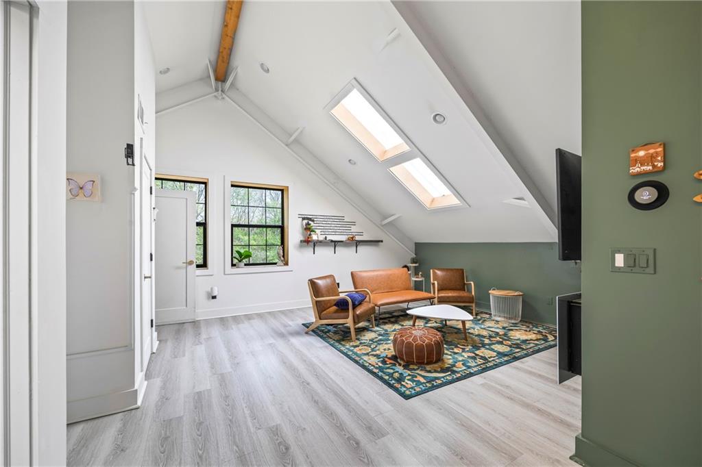 356 West Oak Grove Road Northwest Adairsville, GA 30103 - Photo 49 of 128 a living room with furniture and a wooden floor