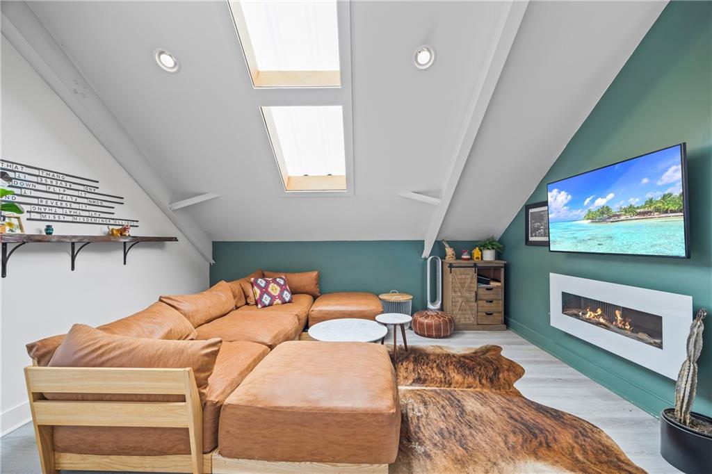 356 West Oak Grove Road Northwest Adairsville, GA 30103 - Photo 50 of 128 a bedroom with furniture and a flat screen tv