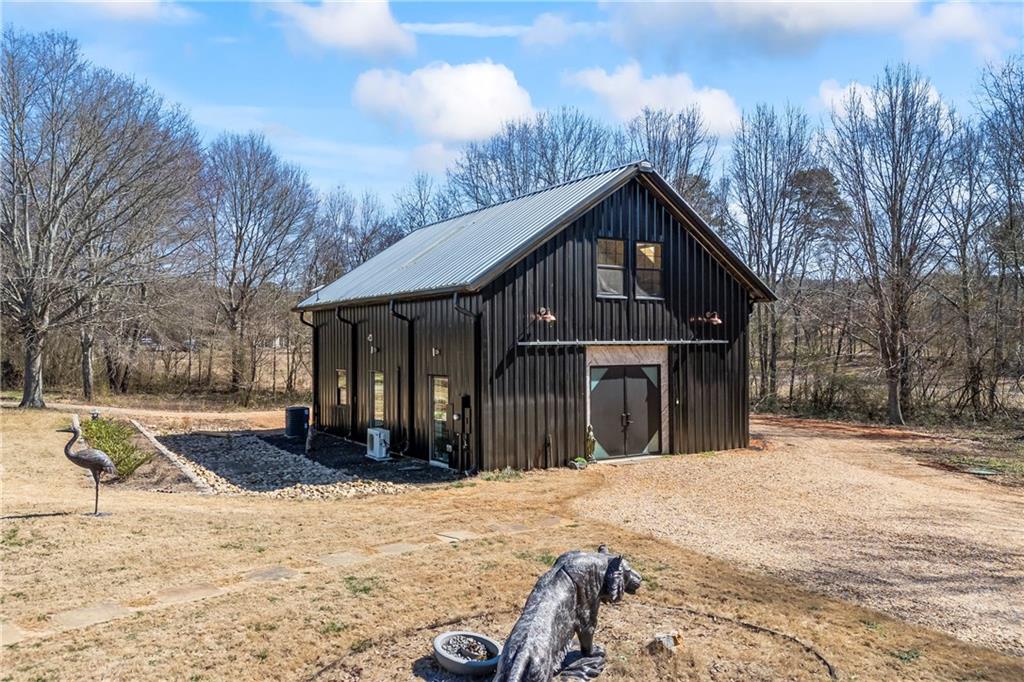 356 West Oak Grove Road Northwest Adairsville, GA 30103 - Photo 52 of 128 a front view of a house with a yard covered in snow