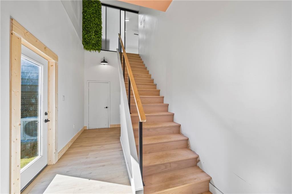 356 West Oak Grove Road Northwest Adairsville, GA 30103 - Photo 59 of 128 a view of a hallway with wooden floor and entryway