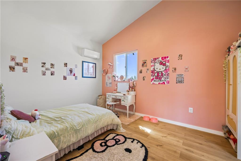 356 West Oak Grove Road Northwest Adairsville, GA 30103 - Photo 70 of 128 a bedroom with a bed and wooden floor