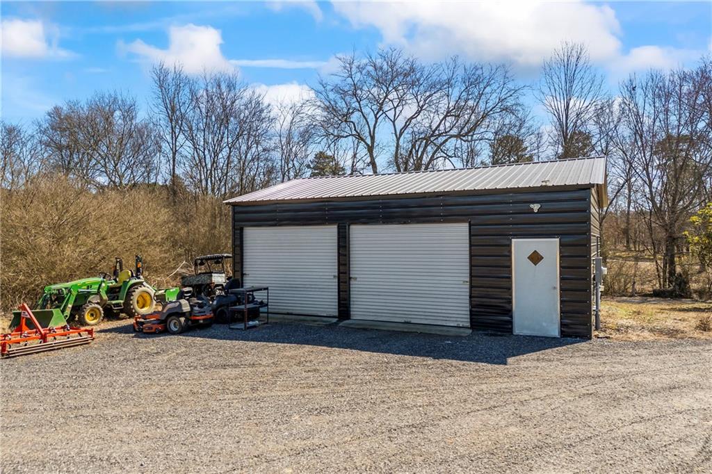 356 West Oak Grove Road Northwest Adairsville, GA 30103 - Photo 76 of 128 a view of a house with a yard and garage