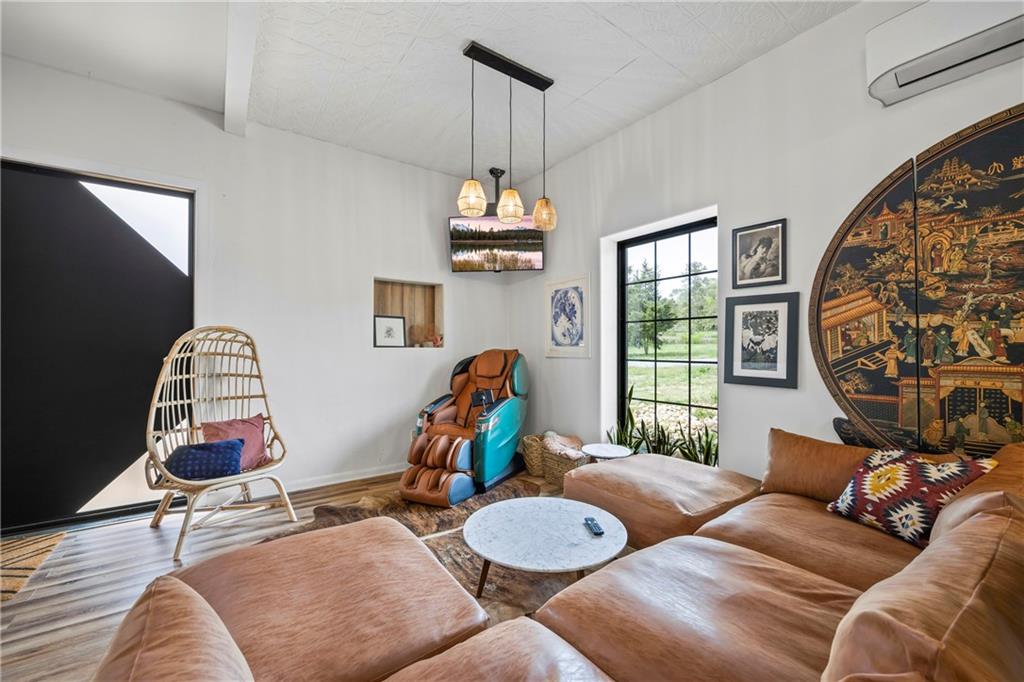 356 West Oak Grove Road Northwest Adairsville, GA 30103 - Photo 9 of 128 a living room with furniture a chandelier and a window