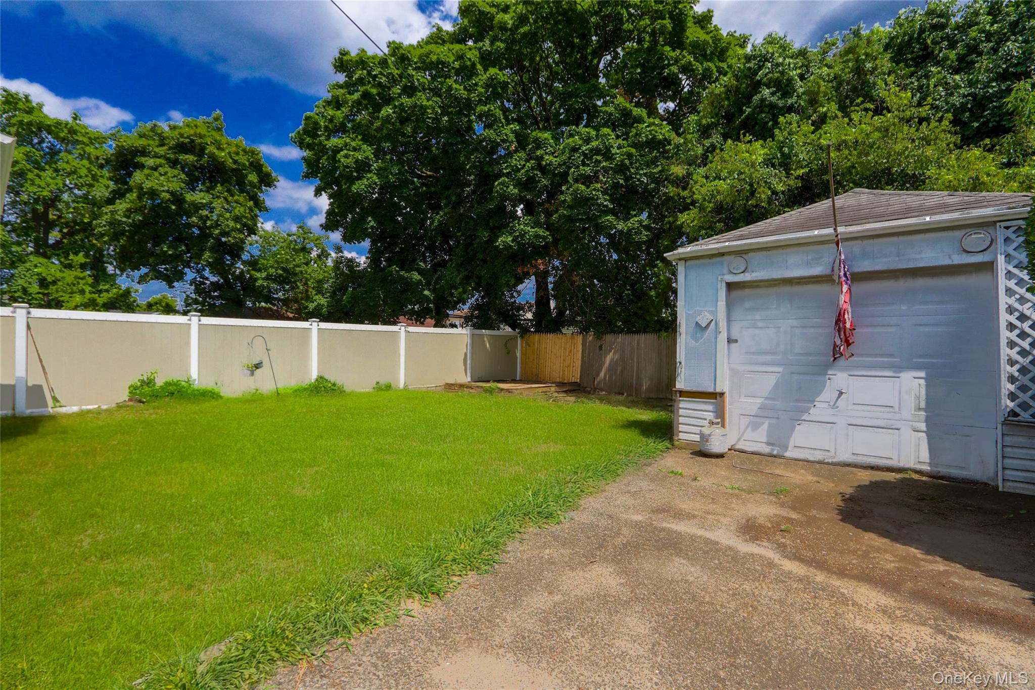 130-55 222nd Street Queens, NY 11413 - Photo 13 of 14 View of yard & detached garage