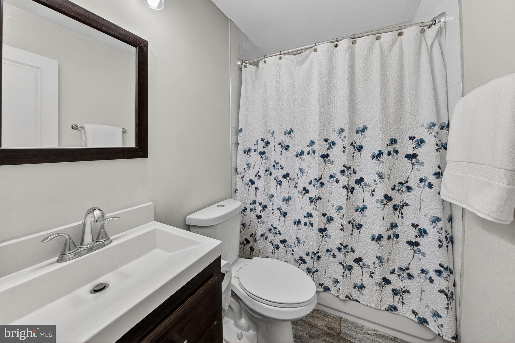 6802 Niles Drive Laurel, MD 20707 - Photo 14 of 31 Hall Bathroom with Thoughtful Updates