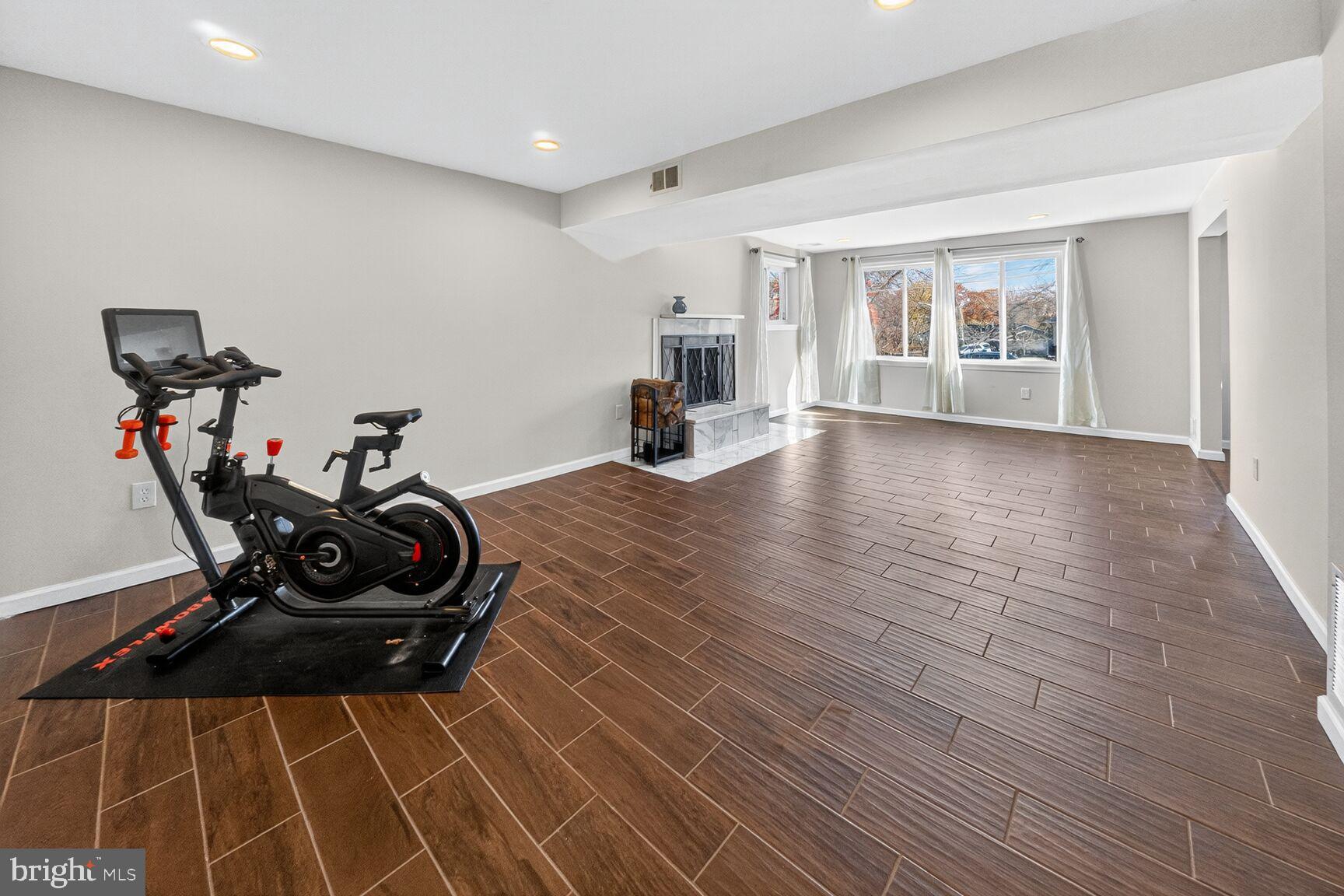 6802 Niles Drive Laurel, MD 20707 - Photo 24 of 31 Spacious Gathering Room with Cozy Fireplace