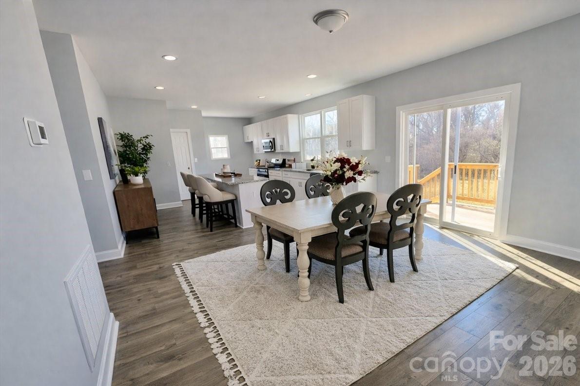 1022 Heath Helms Road Monroe, NC 28110 - Photo 4 of 10 a view of a dining room with furniture window and wooden floor